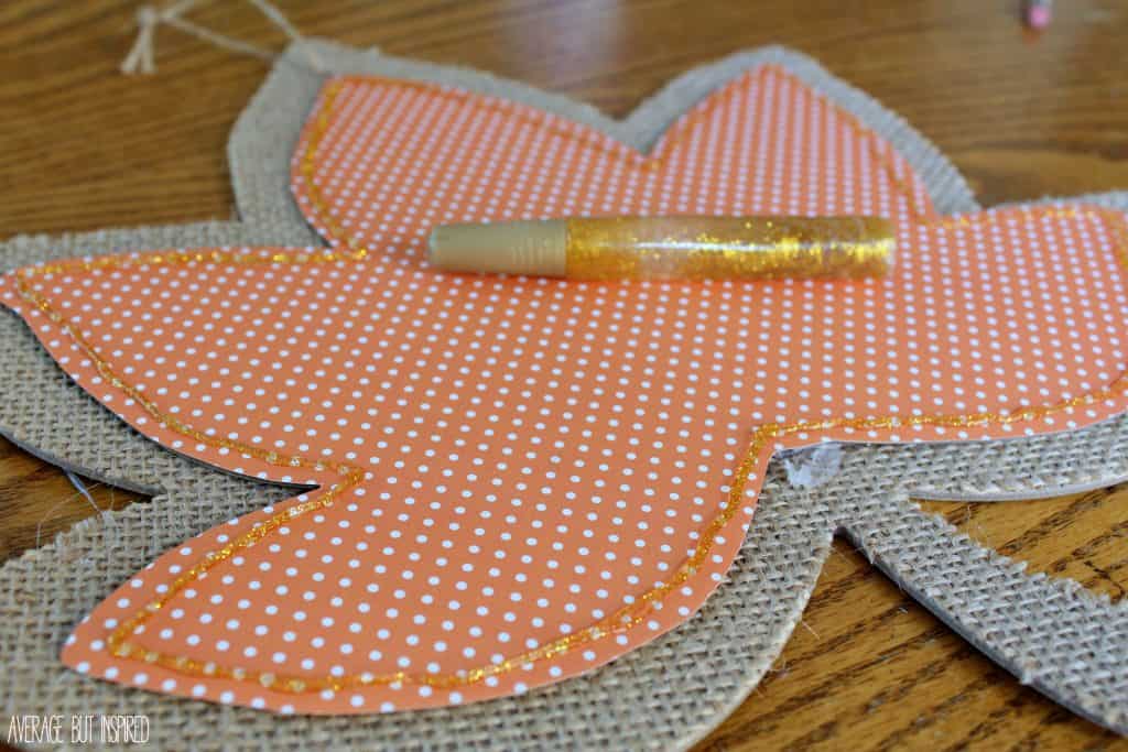 My guest contributor, Bre from Average but Inspired, is sharing a fun upcycle for a dollar store autumn leaf. Find the tutorial at diy beautify! glue the two leaves together and outline with glitter glue